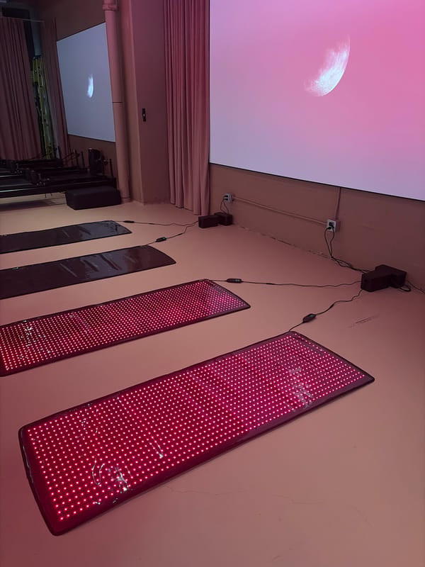 Red light therapy panels illuminate Montreal interior space