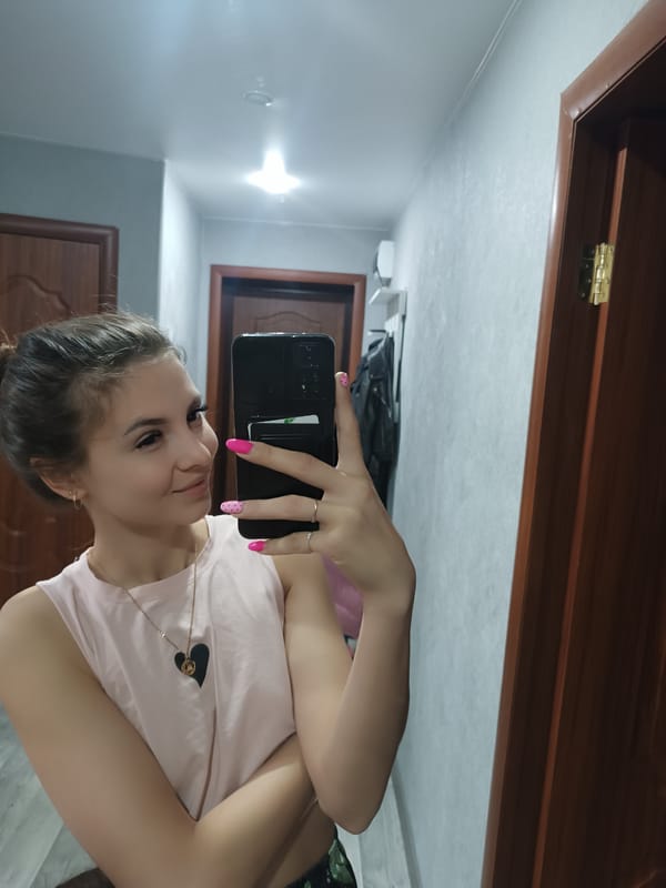 Woman photographs herself at home during morning routine