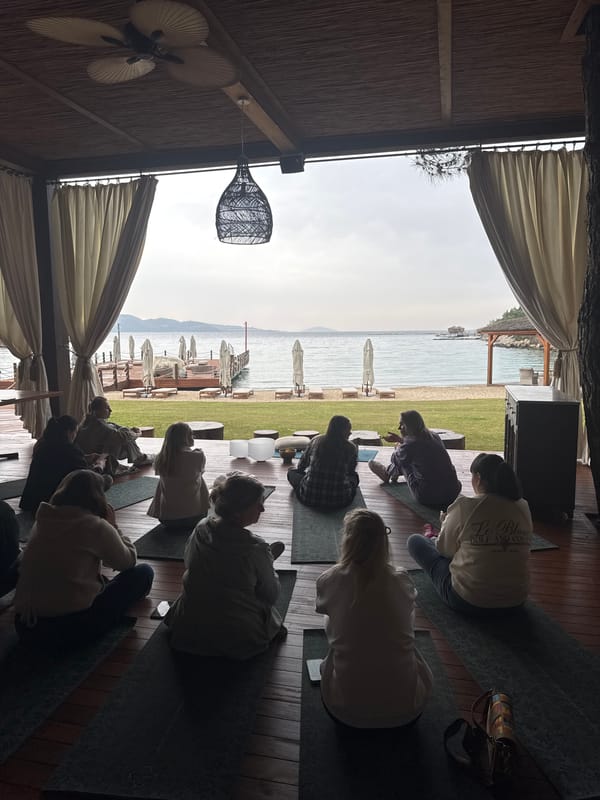 Yoga class held on waterfront deck in Bodrum, Turkey