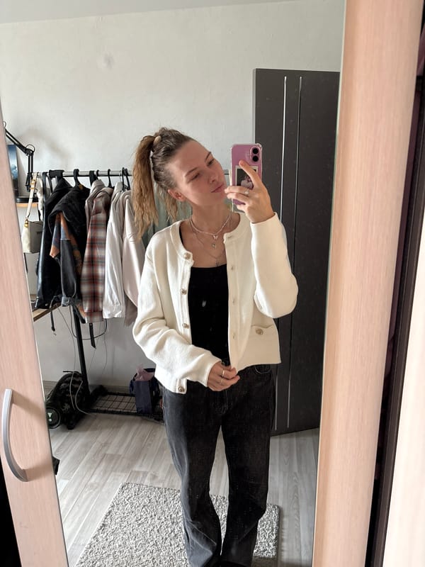 Mirror selfie session trying out hairstyles in Perm apartment