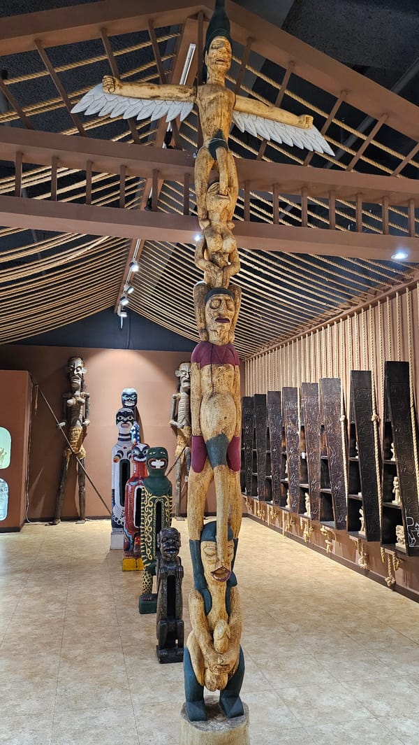 Inside a museum mixing folk carvings and contemporary displays