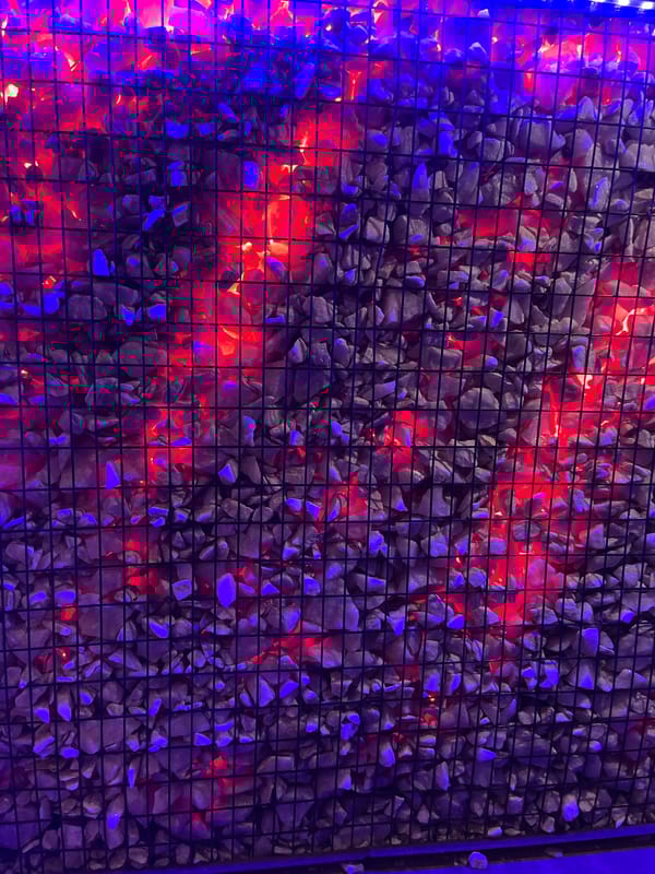 Nighttime scenes captured in Jos show illuminated wall, quiet street