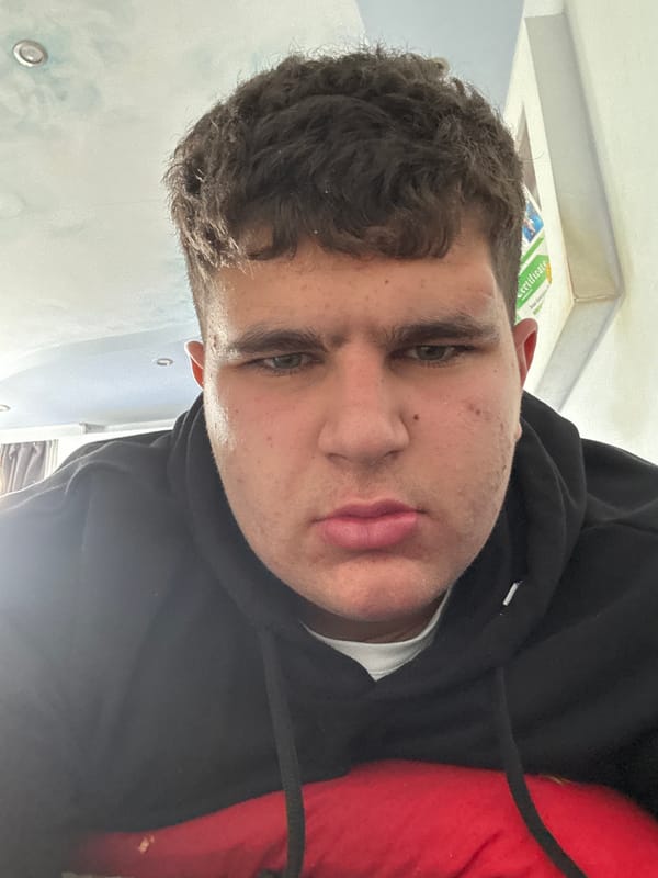 Person photographed in Kazanlak wearing black hoodie
