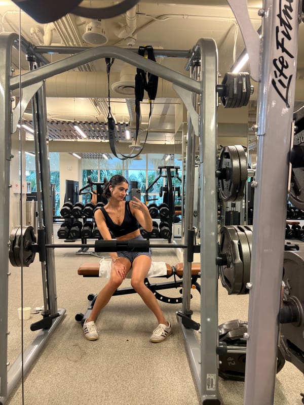 Woman takes selfie in Miami Beach elevator while holding charger