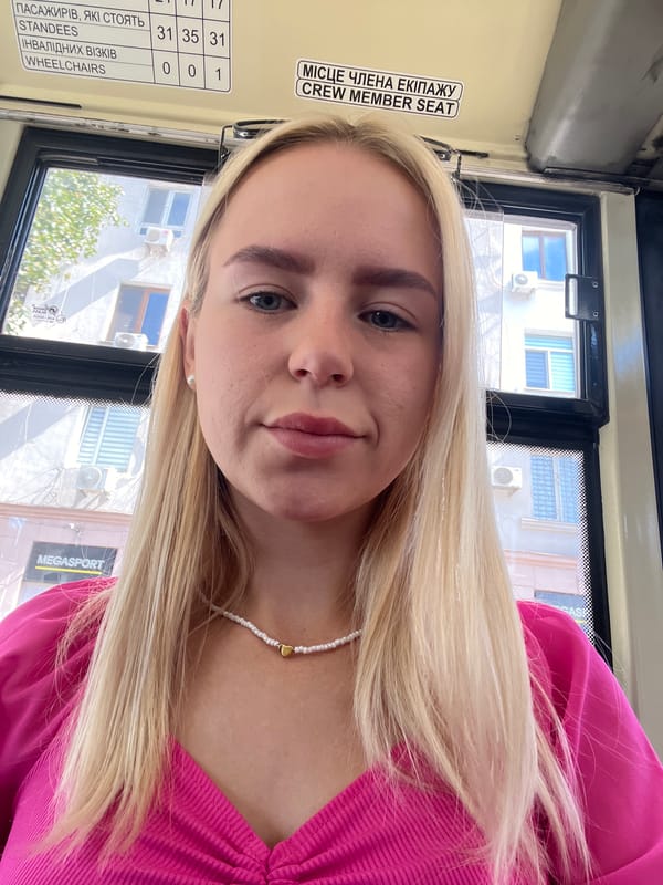 Selfie series on a sunny road trip, pink top and open skies