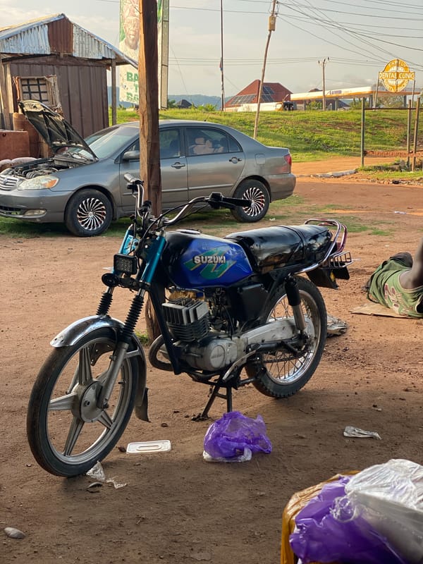 Daily life moments captured around motorcycle repair shop in Jalingo