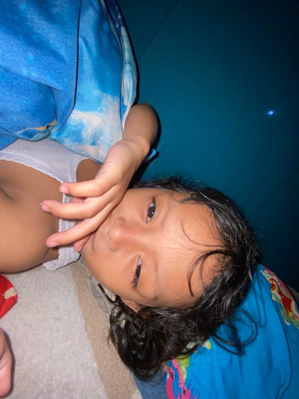 Child resting peacefully at home in Gelam, Indonesia