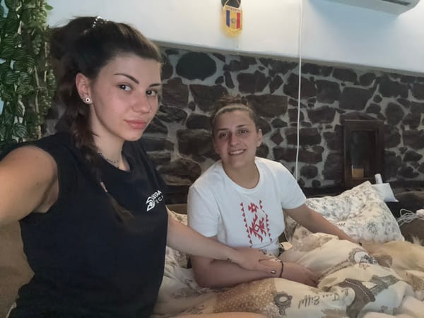 Two women rest indoors in Belopoptsi, Bulgaria room