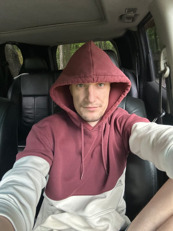 Live streaming from a parked car near a wooded rest area in Shatava
