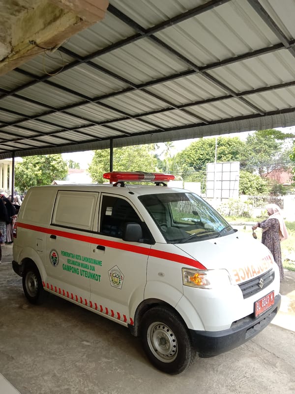 Community gathering with ambulance presence documented in Lhokseumawe, Indonesia