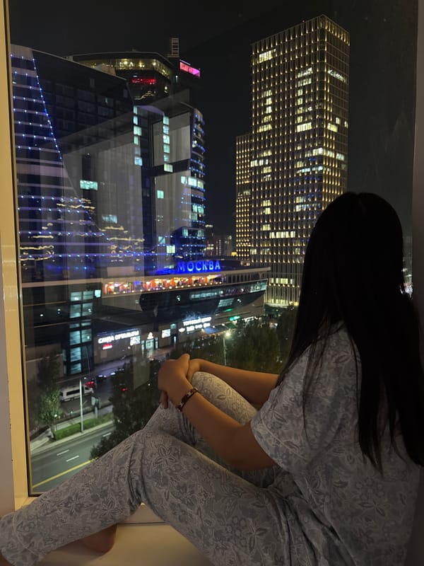 Night in Astana: city skyline views from a high-rise window
