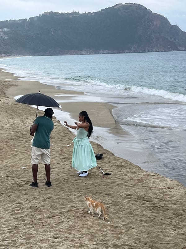 Couple spends overcast morning on Alanya beach with umbrella