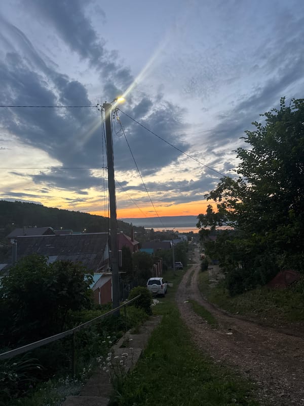 Rope swing evening in village overlook at sunset