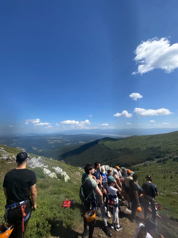 Harnessed group takes a break on a Bulgarian mountainside