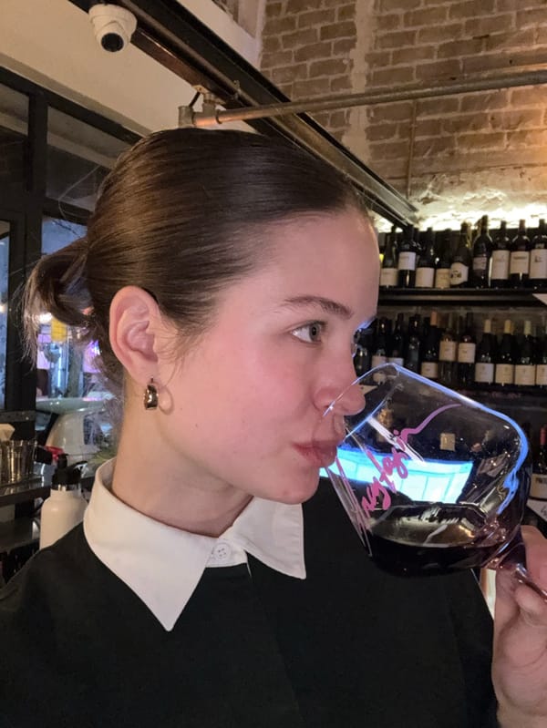 Woman enjoys wine at Tel Aviv beverage establishment