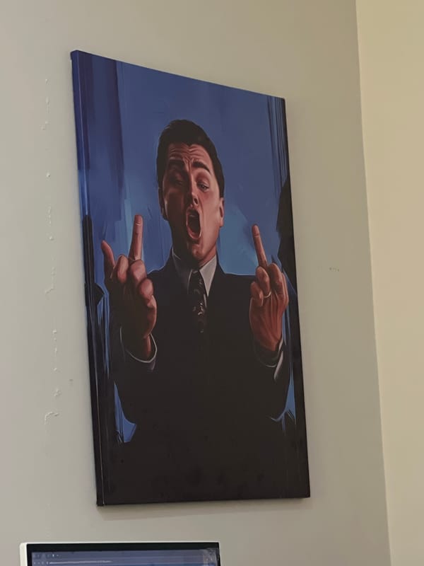 Formal portrait artwork observed on wall in Astana