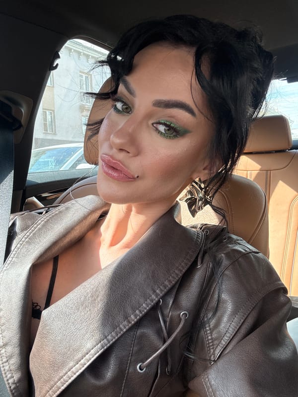 Woman takes selfie inside car in Krasnoyarsk