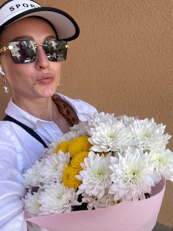 Woman with flower bouquet photographed in Budva, Montenegro
