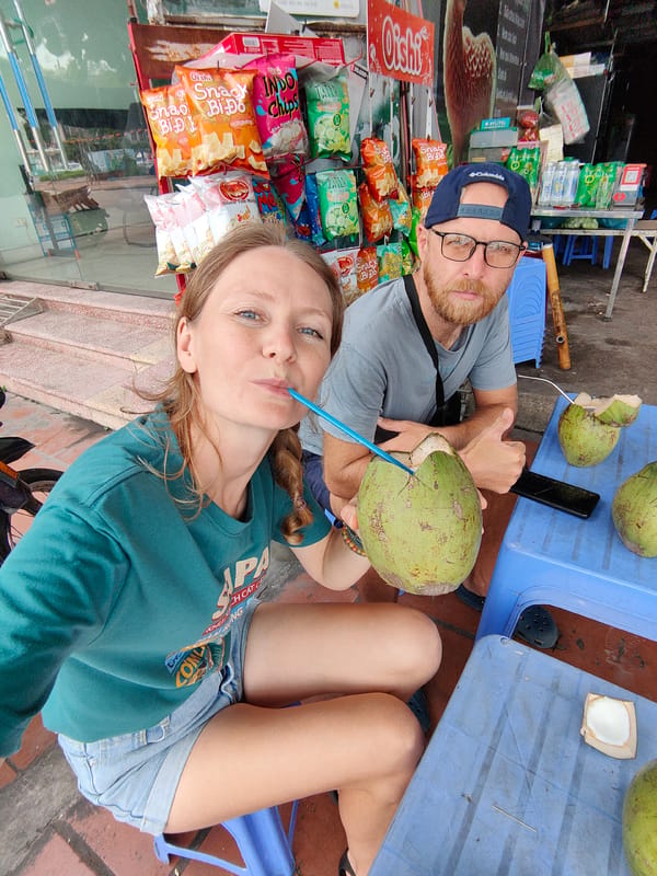 Early morning coconut vendors serve customers in Vietnam ward