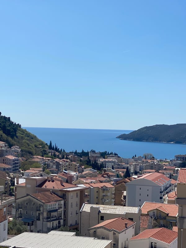 Aerial views document Budva's coastal cityscape from above