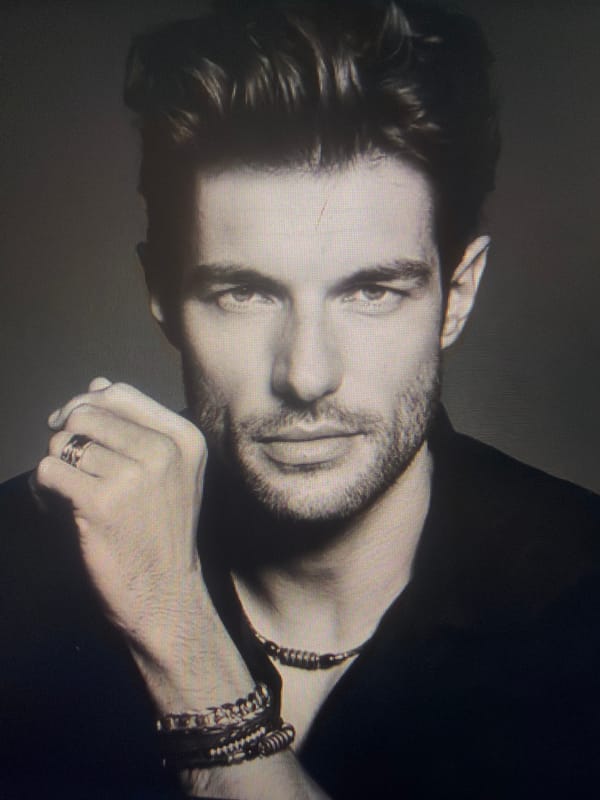 Contemplative portrait captured in Sofia shows man in jewelry