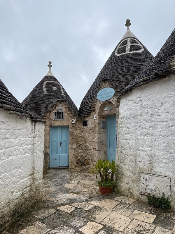 Traditional Trulli houses with conical roofs documented in Alberobello