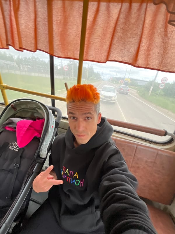Orange-haired man takes selfie on Chaikovsky public transport
