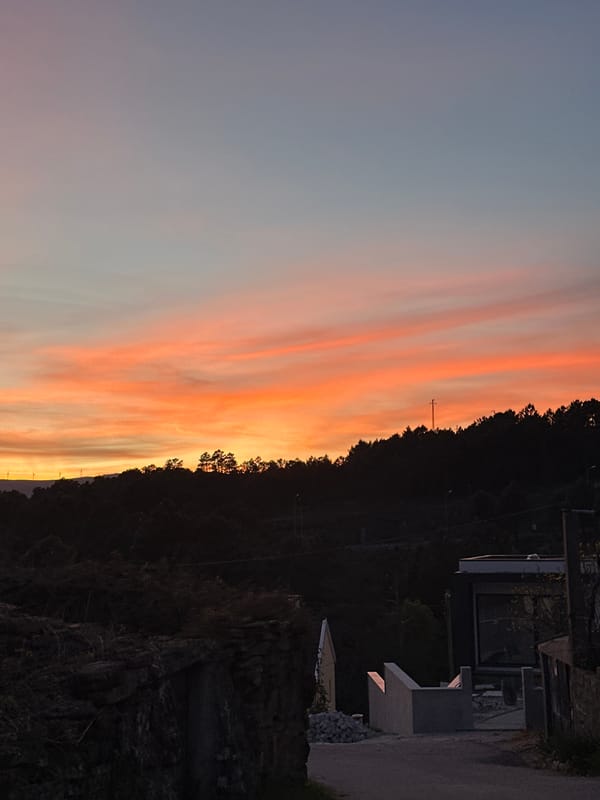 Sunset illuminates Vila Real, Portugal with orange-pink skies