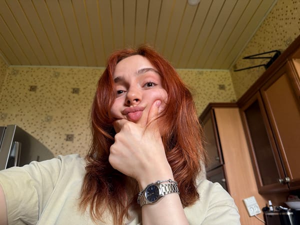 Woman takes selfies while eating candy in Tbilisi home