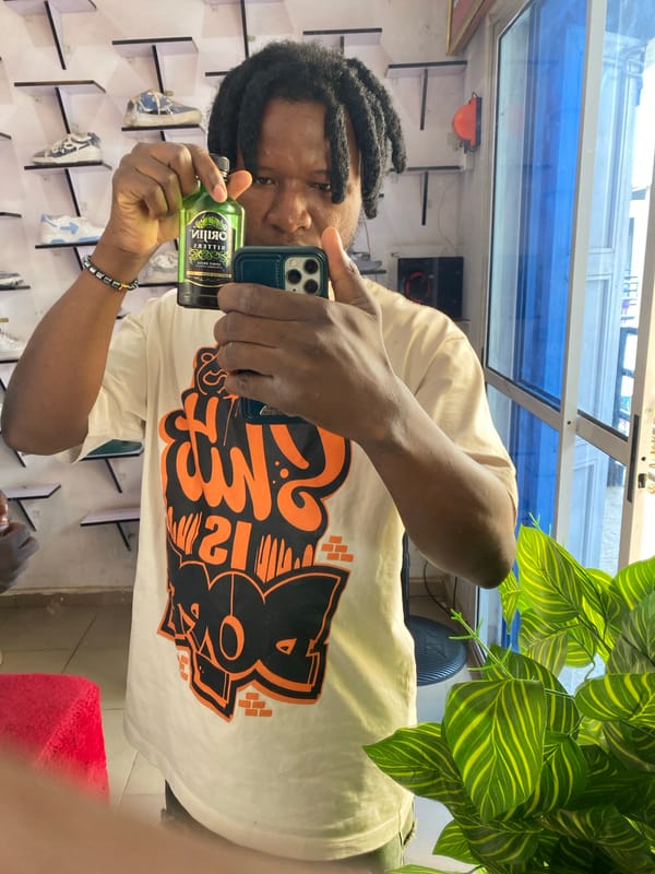 Mirror selfie inside a Jos shoe store, July 2026