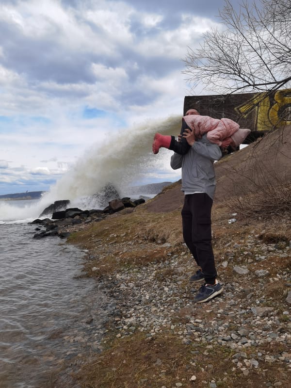 Family visits dramatic water spillway in Chernushka, Russia