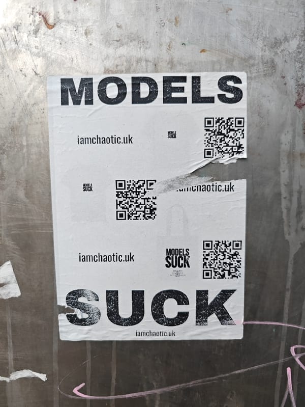 White poster spotted on grey urban surface in London