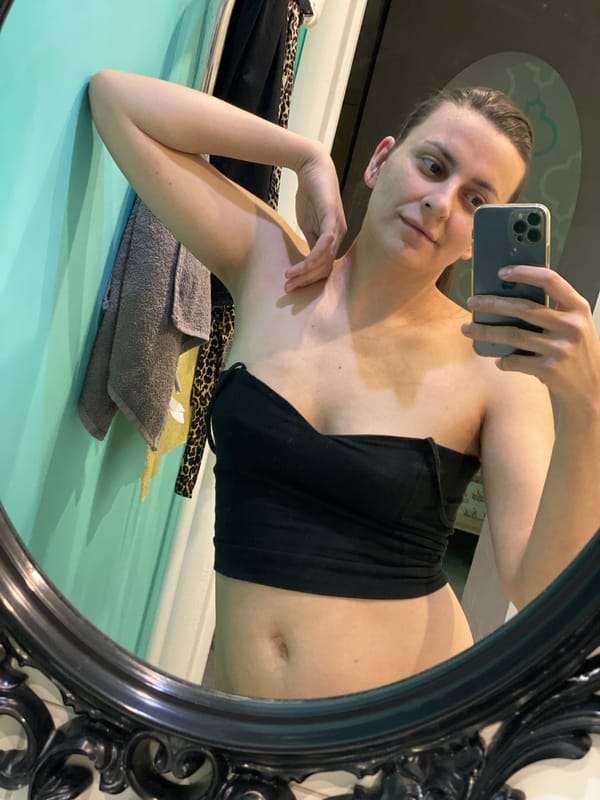 Woman captures mirror selfie while lying down