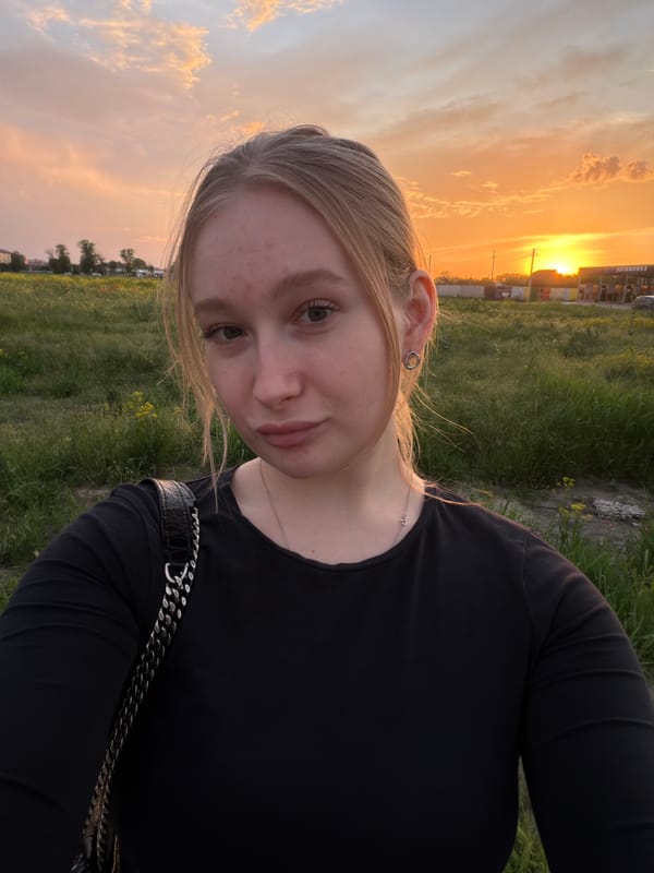 Woman takes sunset selfie in Krasnodar field