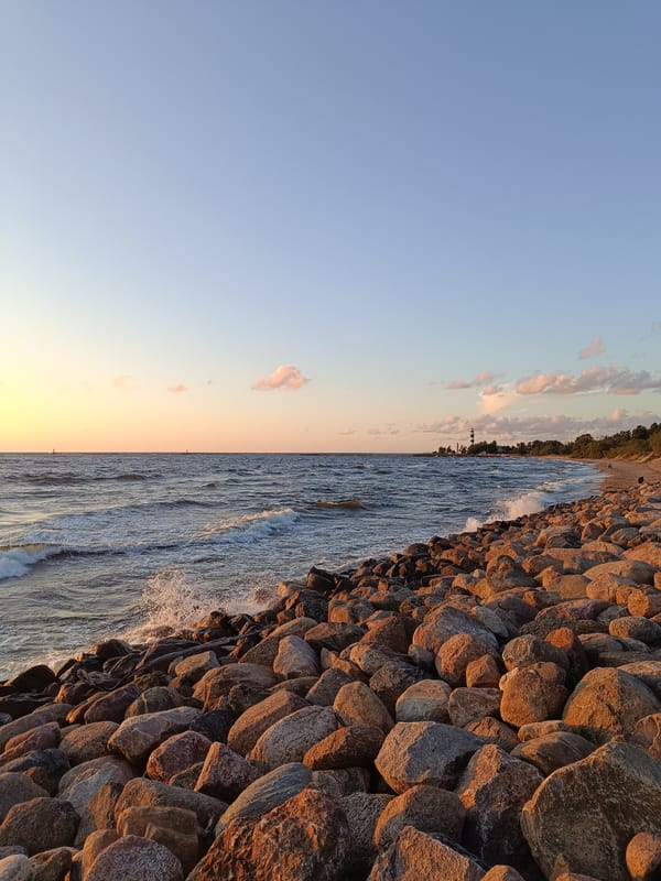 Golden hour on the Baltic, rocky Riga shoreline at sunset