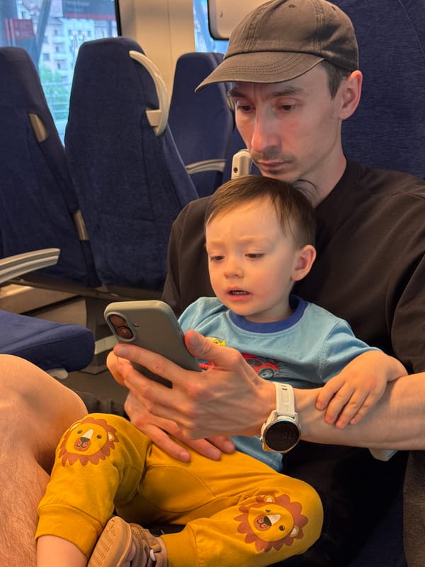 Man and child travel by train in Estosadok