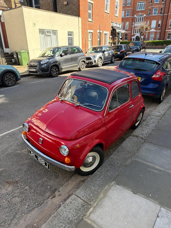 Vintage red car spotted parked on London street