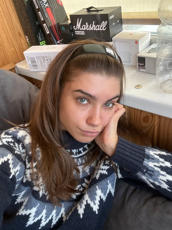 Woman rests with hand to cheek in Khimki