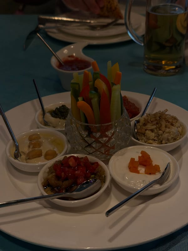 Group shares traditional meal in Tashkent restaurant setting