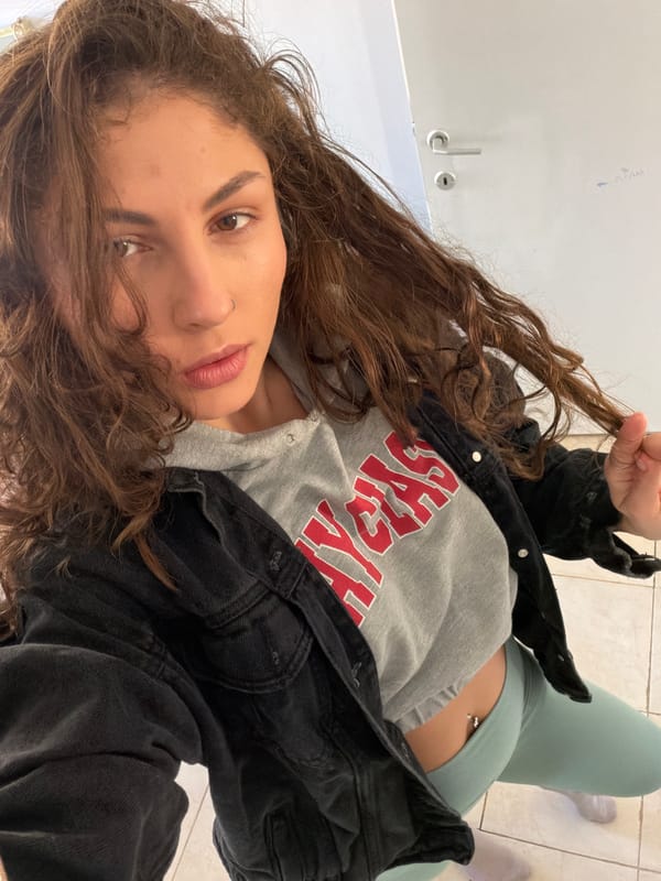 Woman takes mirror selfies in Kiryat Bialik apartment