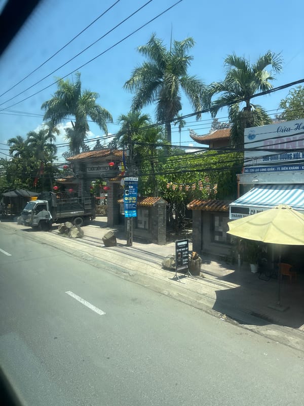 Street-level tour through a busy Vietnamese city's commercial district