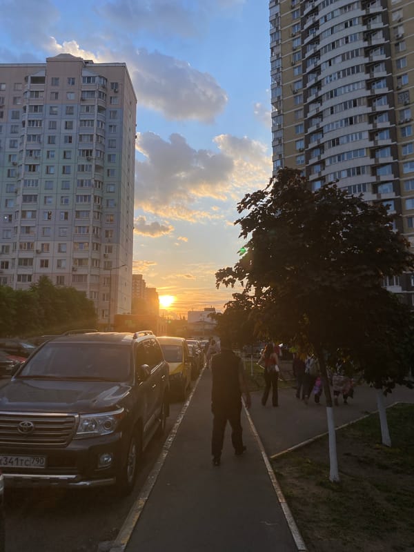 Sunset street scene with residential buildings captured by witness