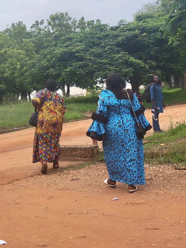 Afternoon street life documented in Keffi, Nigeria under overcast skies