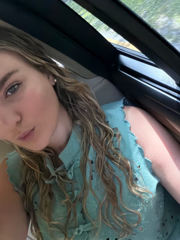 Woman photographed in car interior in Key Biscayne