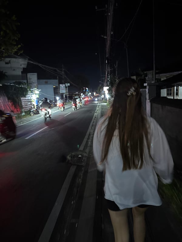 Person walks along street in Ungasan, Indonesia