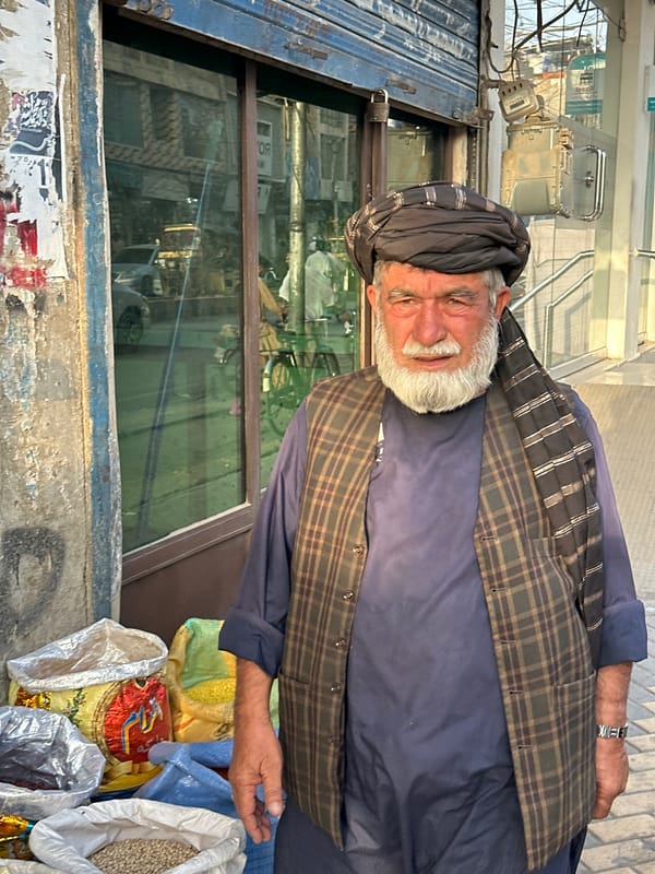 Outside a Quetta storefront, bags and goods on display