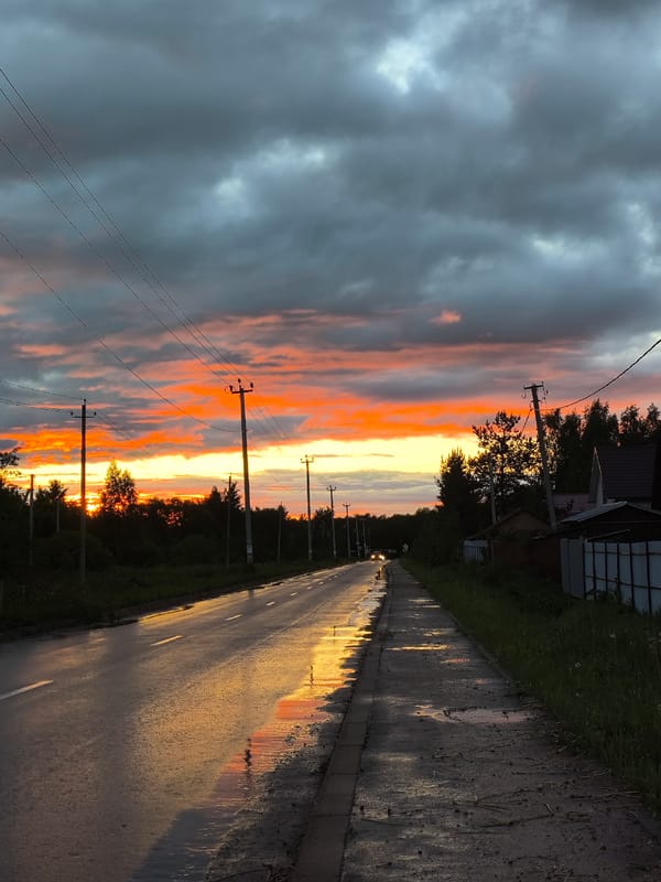 Post-Rain Sunset Reflections Captured Along Rural Roads