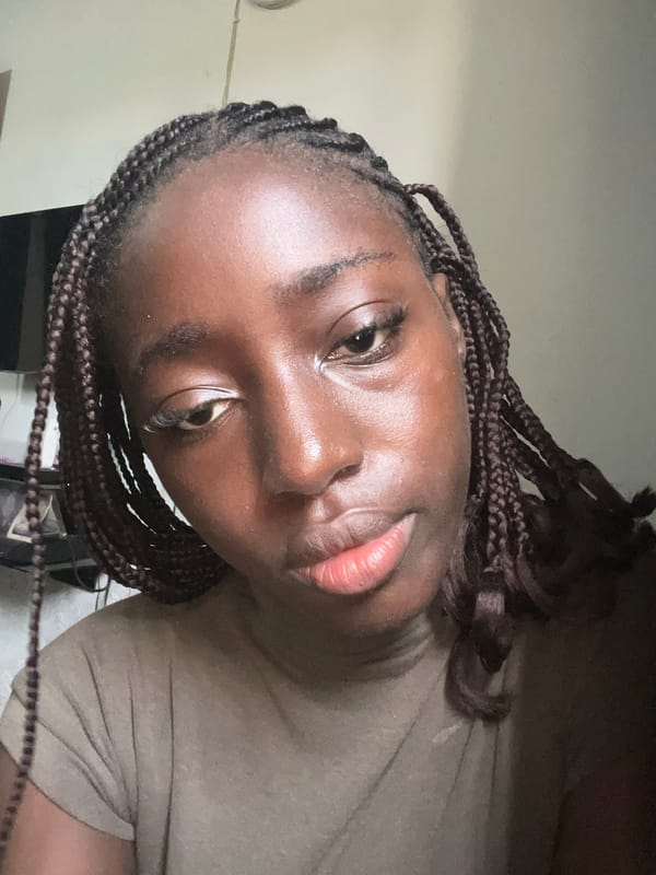 Woman photographed indoors in Abuja home setting
