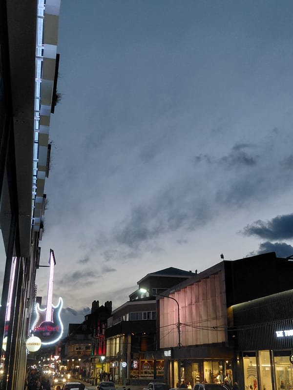 Evening street activity around Hard Rock Cafe in Ushuaia