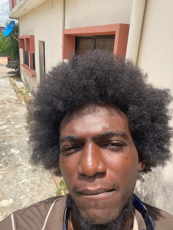 Man photographed smoking and relaxing outdoors in Lagos
